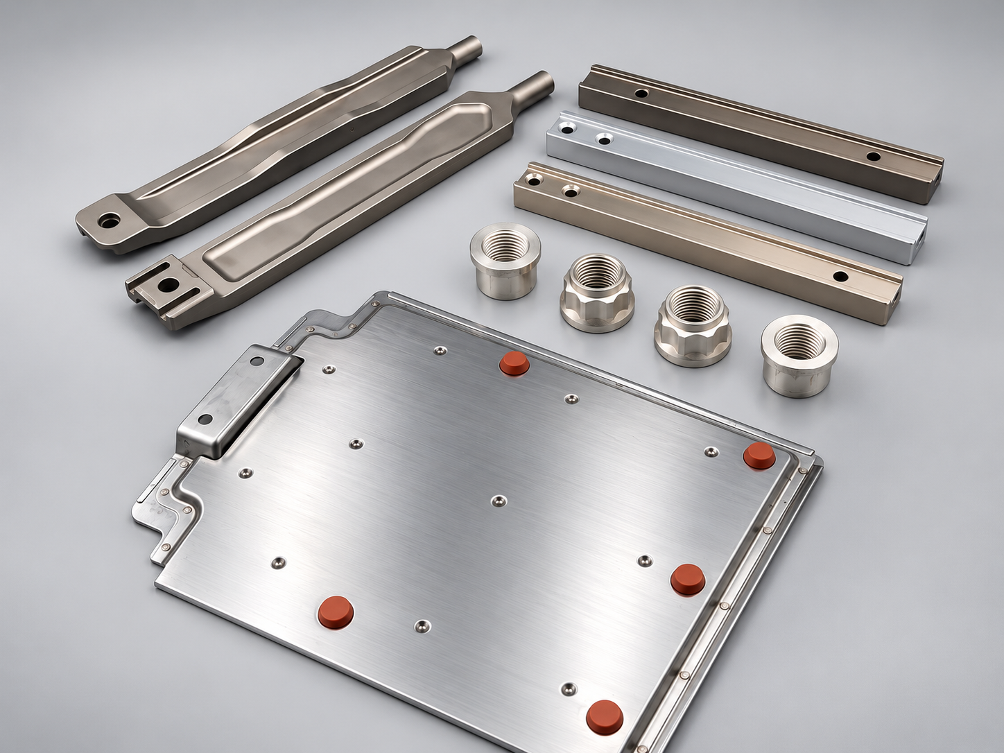 Selection of AMT wheel and brake components: heat shield plate, torque bars, drive inserts and self-locking nuts
